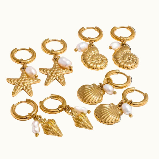 Gold hoop earrings with starfish, shell, and pearl charms on a white background, featuring the brand 'Yi Fayu'.